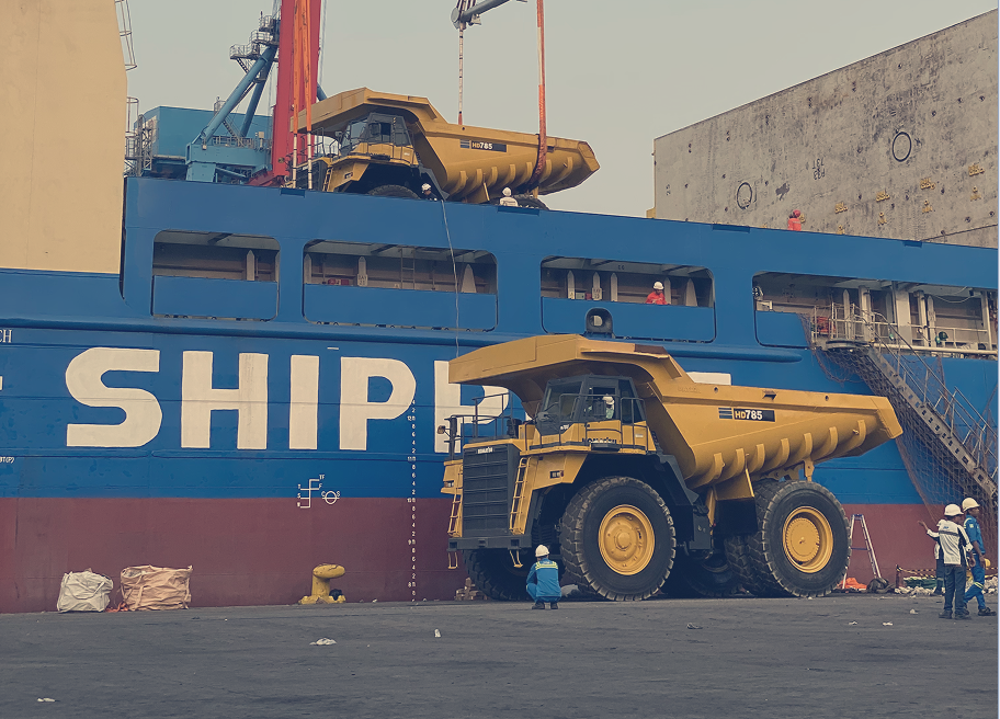 Komatsu HD785 mining trucks handled with precision during vessel loading at the port